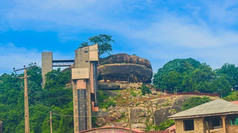 Olumo Rock in Abeokuta with the lift towers of the tourist complex.